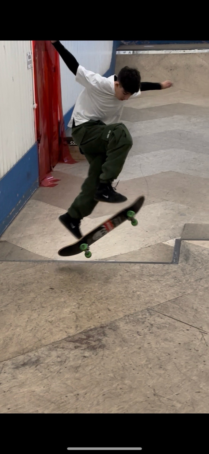Azi skating at an indoor park